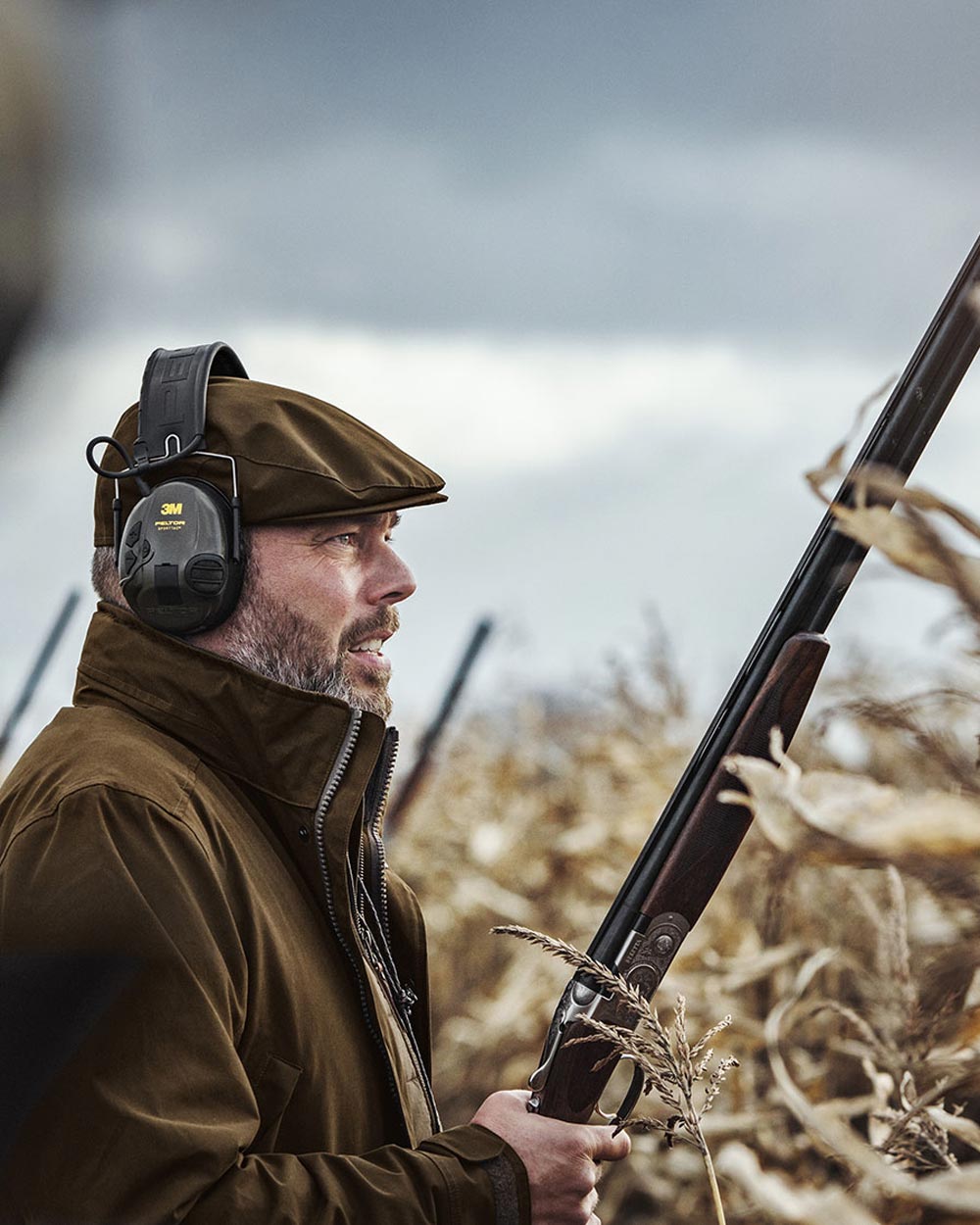 Warm Olive Coloured Harkila Retrieve Jacket on outdoor background