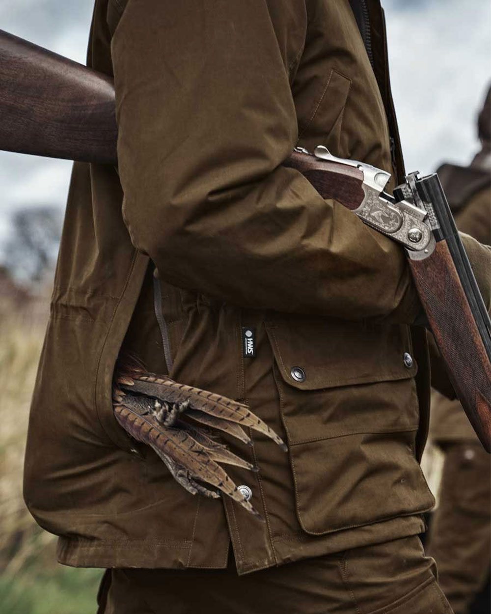 Warm Olive Coloured Harkila Retrieve Jacket on outdoor background