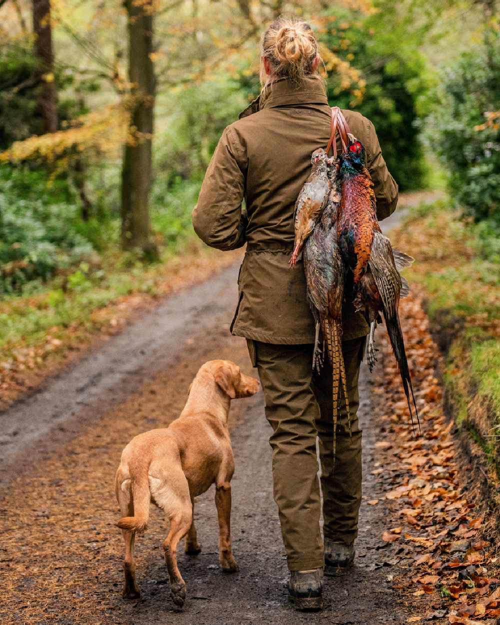 Warm Olive Coloured Harkila Retrieve Lady Jacket on outdoor background