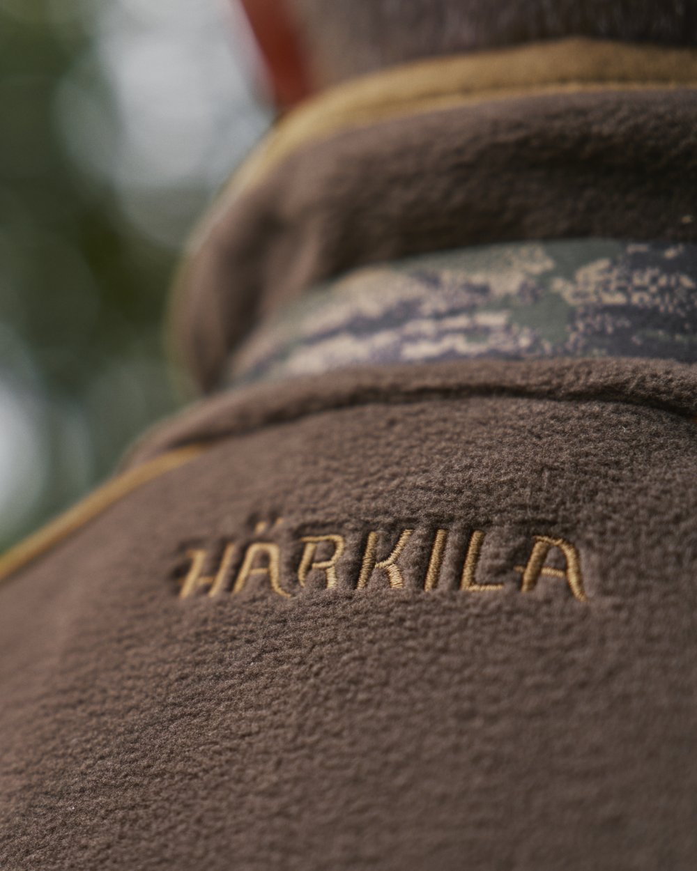 Demitasse Brown Coloured Harkila Sandhem 200 Fleece Waistcoat on forest background