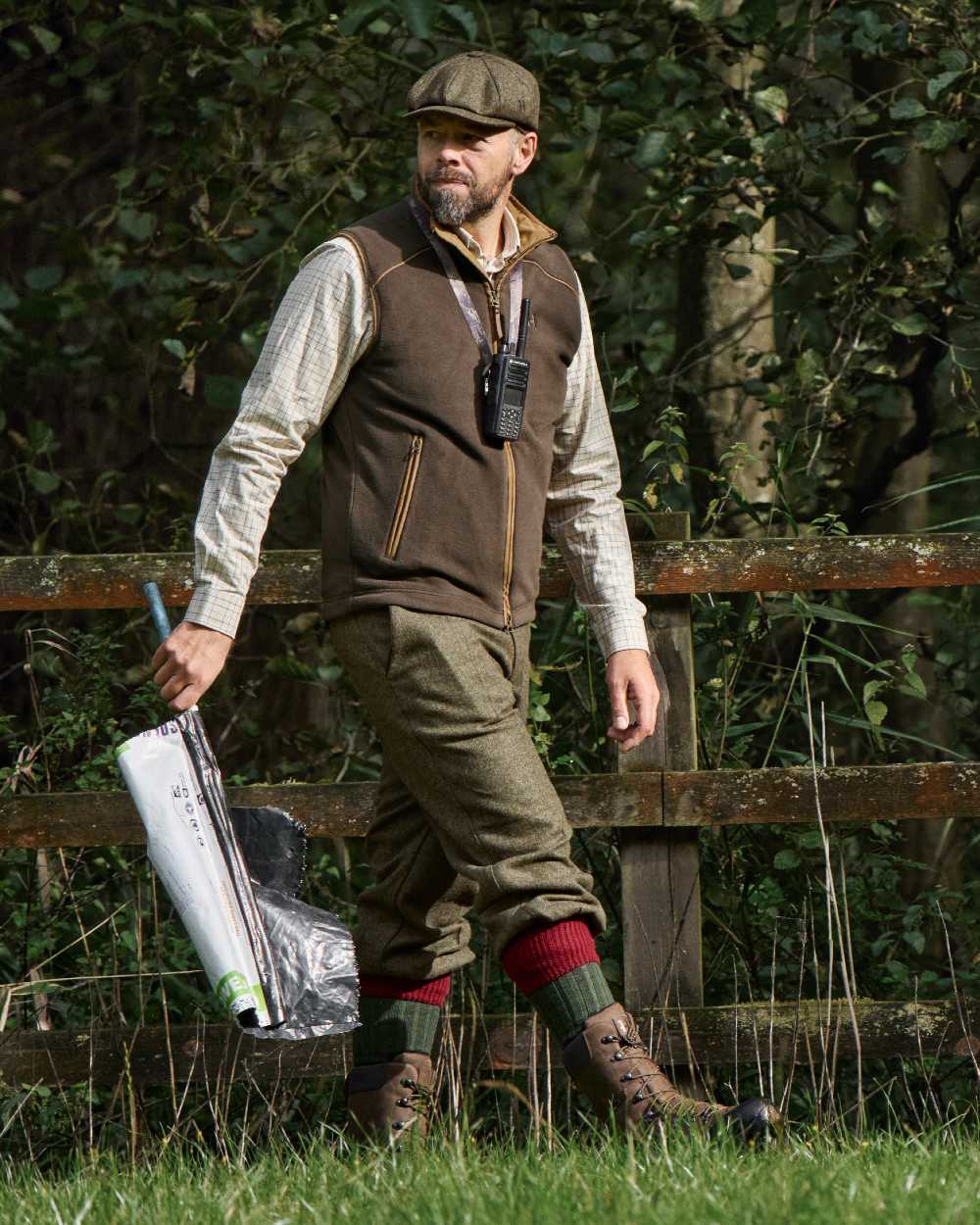 Demitasse Brown Coloured Harkila Sandhem 200 Fleece Waistcoat on forest background