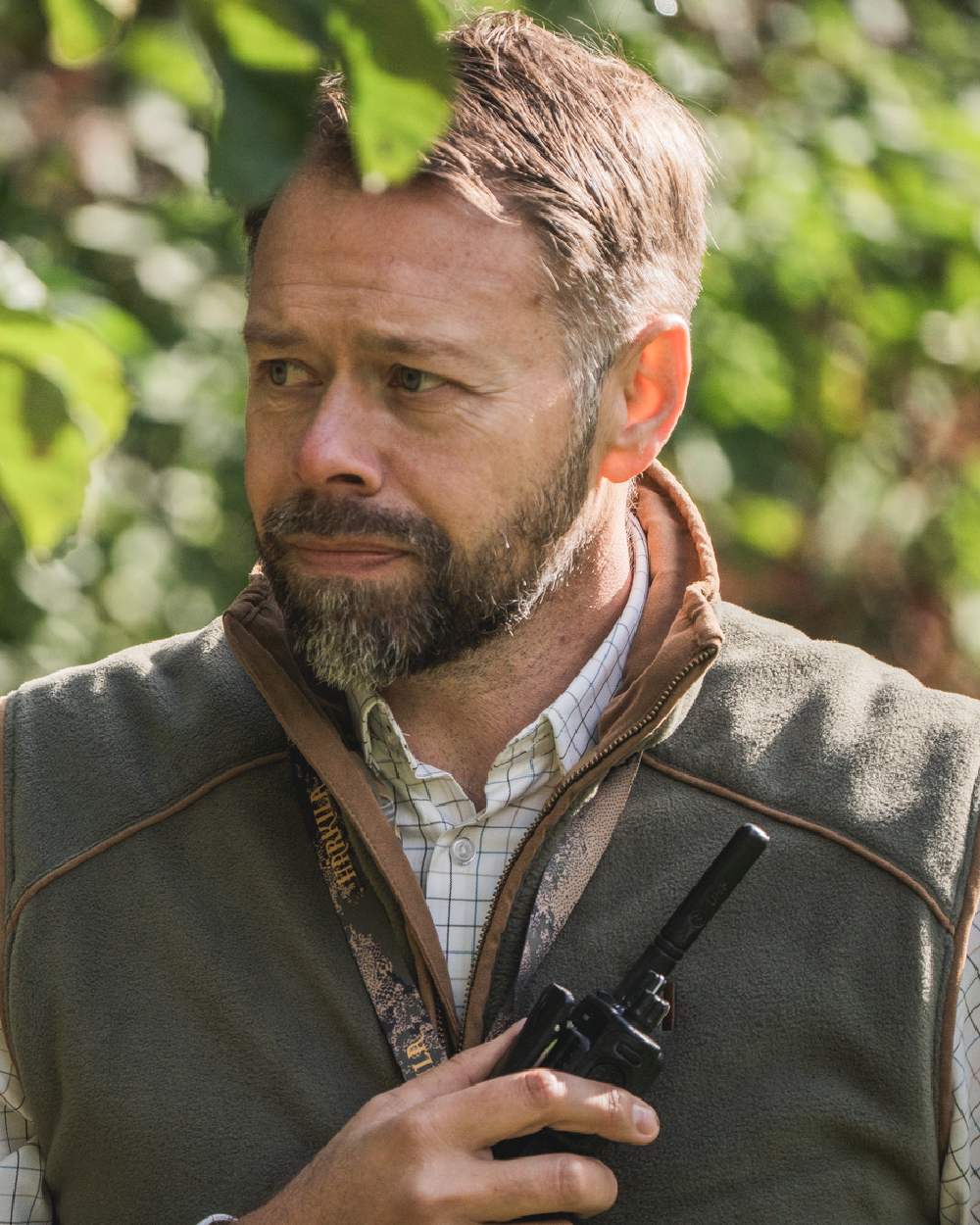 Grape Leaf Coloured Harkila Sandhem 200 Fleece Waistcoat on outdoor background