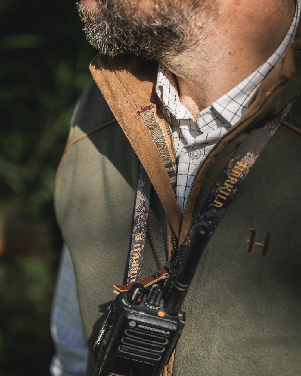 Grape Leaf Coloured Harkila Sandhem 200 Fleece Waistcoat on outdoor background