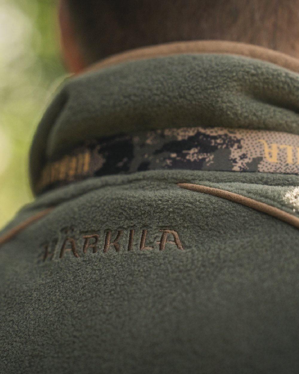 Grape Leaf Coloured Harkila Sandhem 200 Fleece Waistcoat on outdoor background