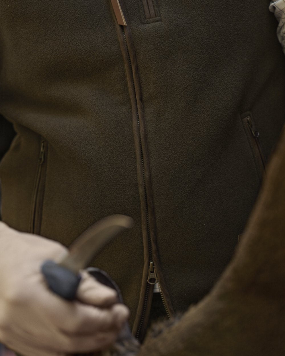 Willow Green Coloured Harkila Sandhem Sherpa Fleece Waistcoat on outdoor background