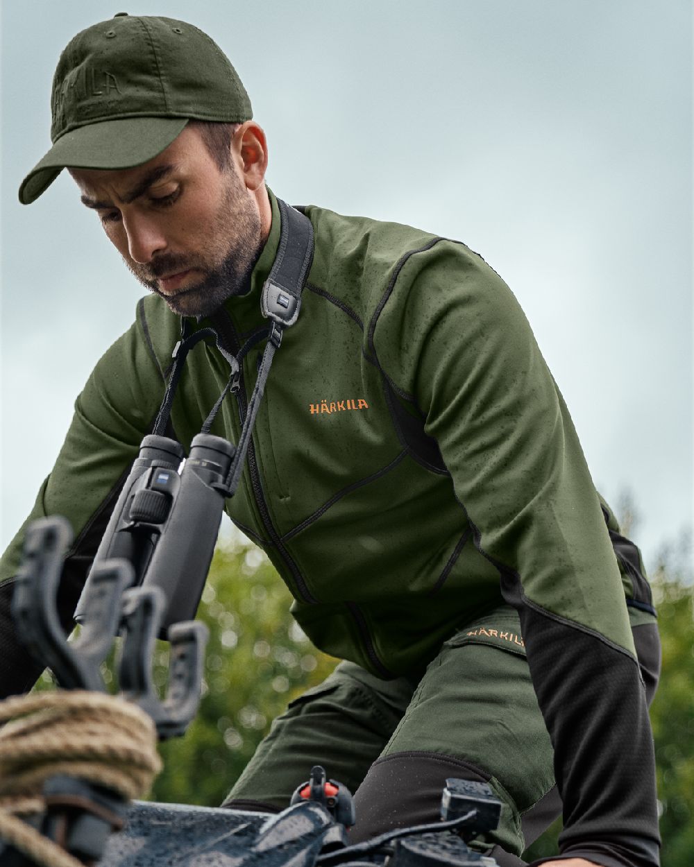 Duffel Green Black Coloured Harkila Scandinavian Fleece Jacket on outdoor background