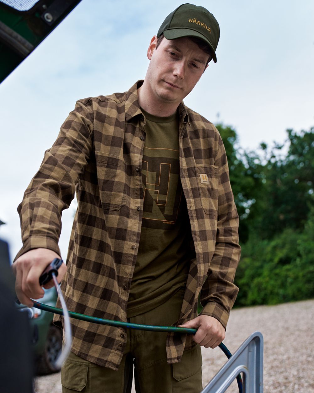 Antique Bronze Check coloured Harkila Scandinavian Long Sleeve Shirt on outdoor background