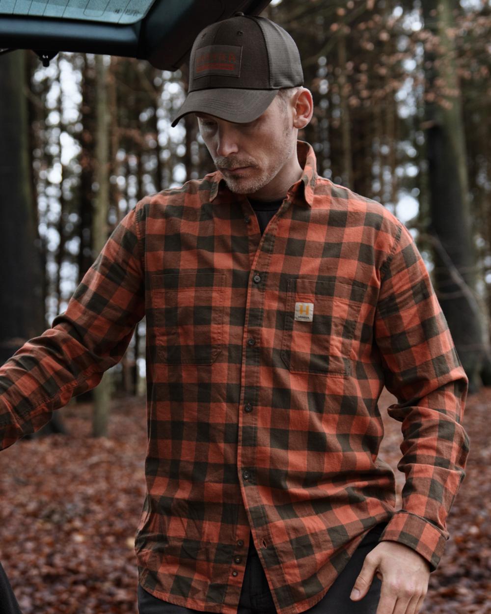 Autumn Orange Check coloured Harkila Scandinavian Long Sleeve Shirt on outdoor background