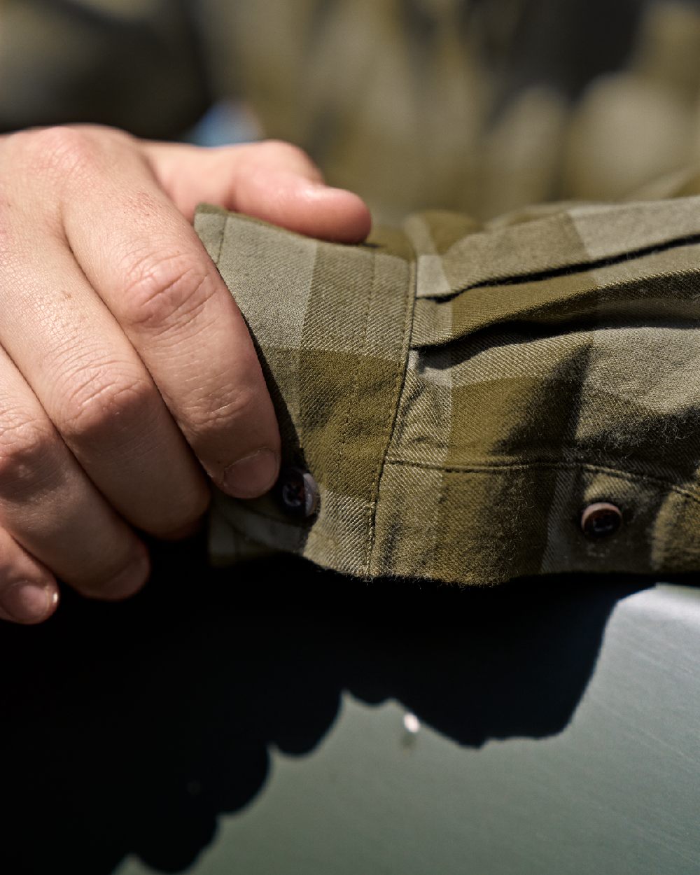 Dark Olive Check Coloured Harkila Scandinavian Long Sleeve Shirt on blurry background