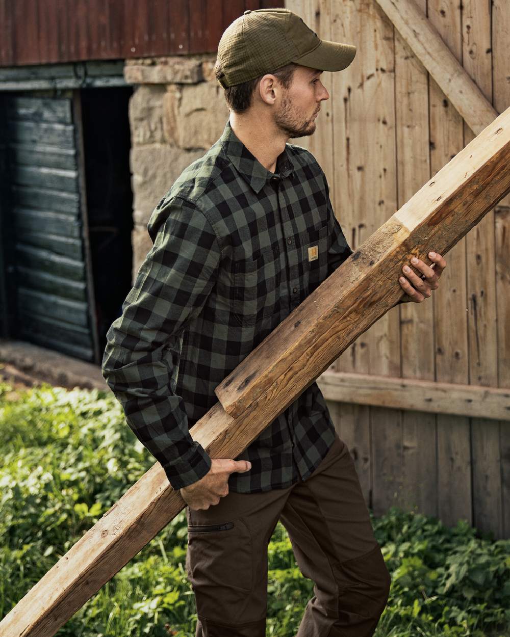 Green Check Coloured Harkila Scandinavian Long Sleeve Shirt on countryside background
