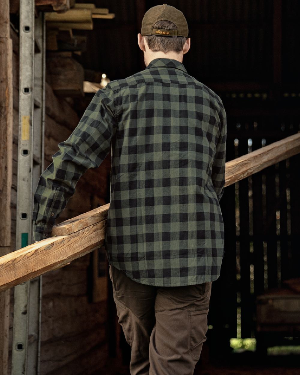 Green Check Coloured Harkila Scandinavian Long Sleeve Shirt on countryside background