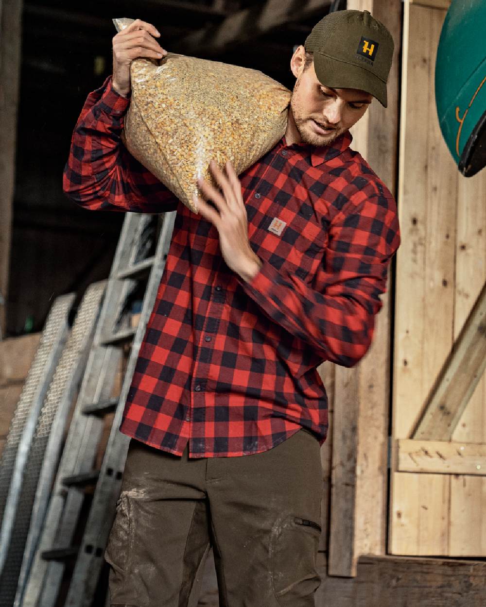 Red Check Coloured Harkila Scandinavian Long Sleeve Shirt on outdoor background
