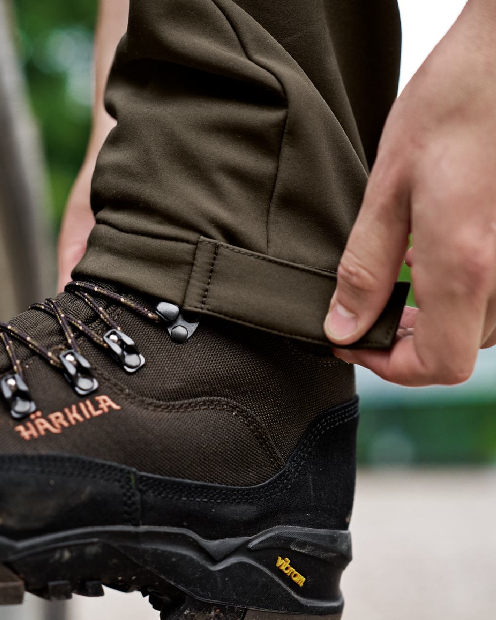 Dark Olive Willow Green Coloured Harkila Scandinavian Trousers on outdoor background