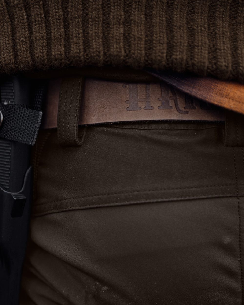 Shadow Brown Deep Brown coloured Harkila Scandinavian Trousers on woodland background