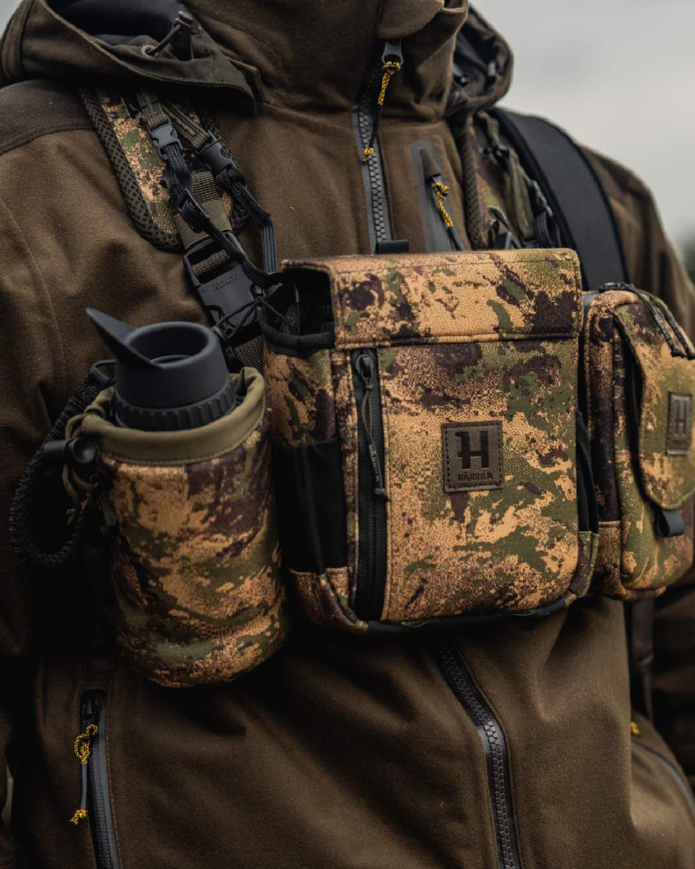 AXIS MSPForest Coloured Harkila Thermal Camo Spotter Pouch on blurry background