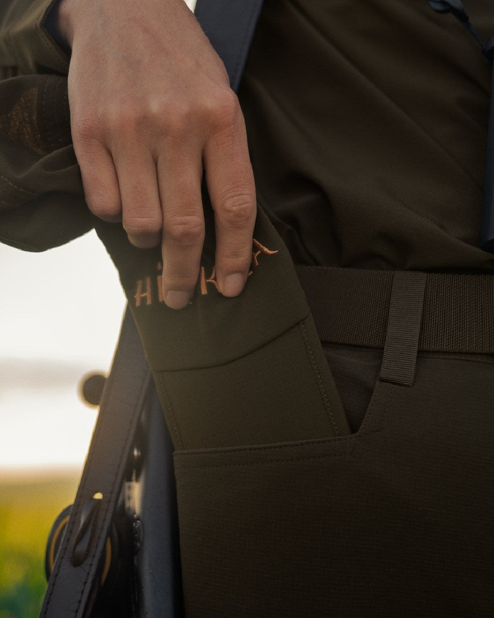 Willow Green Coloured Harkila Trail Foldable Cap on outdoor background