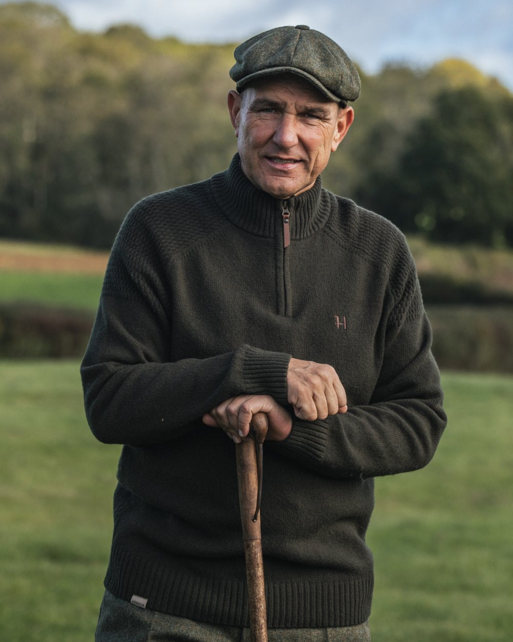 Rosin Coloured Harkila Vincent Merino Half Zip Pullover on forest background