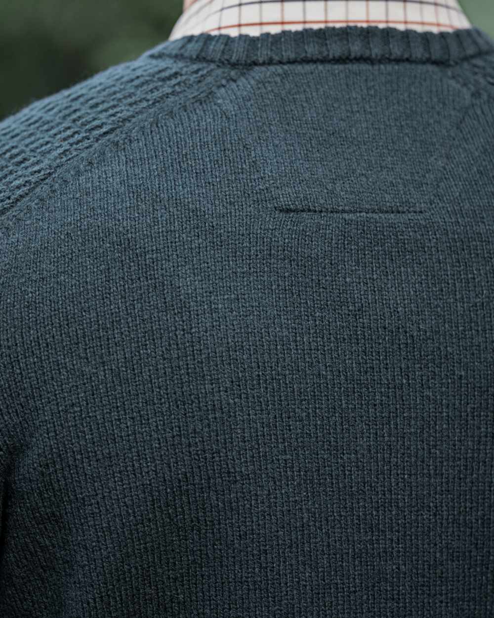 Dark Navy Coloured Harkila Vincent Merino V-Neck Pullover on forest background