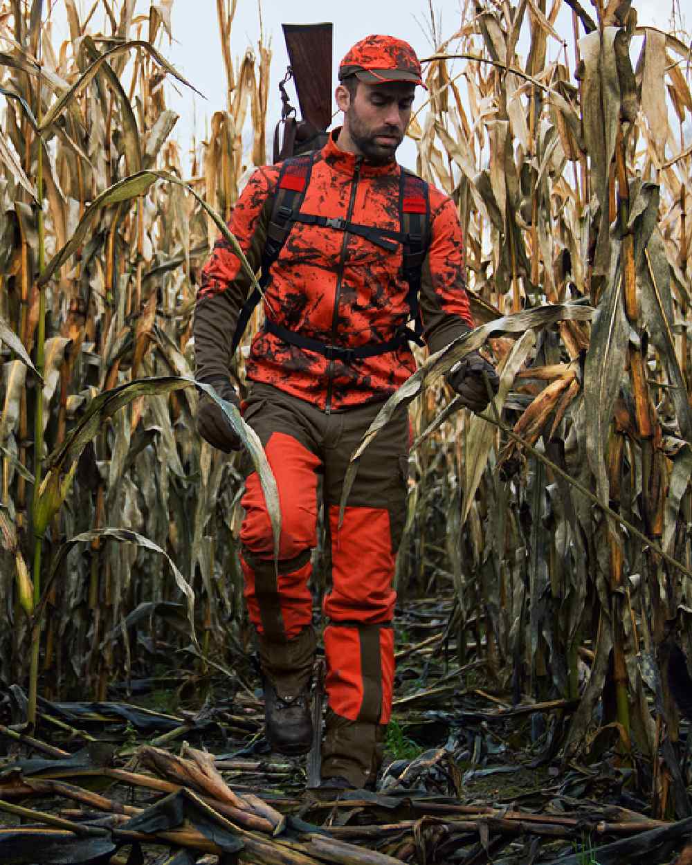 Wildboar Orange Coloured Harkila Wildboar Pro Camo Fleece Jacket on farm background