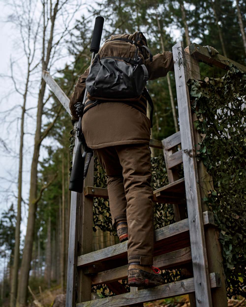 Willow Green Coloured Harkila Womens Driven Hunt HWS Insulated Trousers on forest background