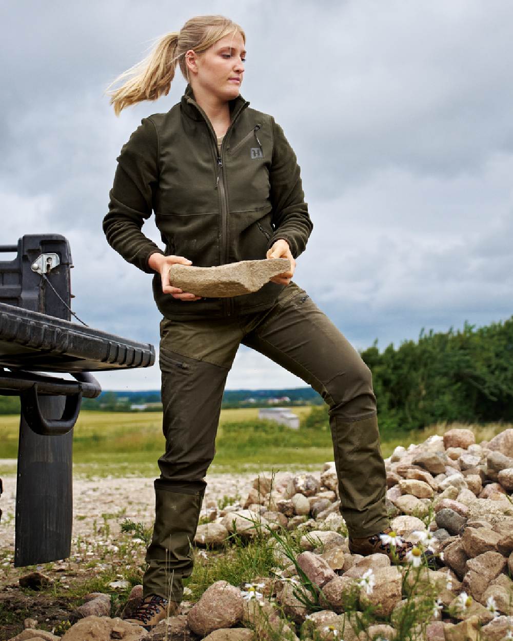 Dark Olive Willow Green Coloured Harkila Womens Fjell Trousers on countryside background