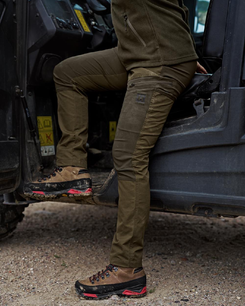 Dark Olive Willow Green Coloured Harkila Womens Fjell Trousers on tractor background