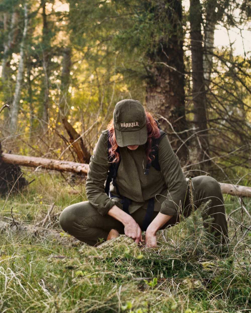 Willow Green Coloured Harkila Womens Herlet Tech Shirt on forest background