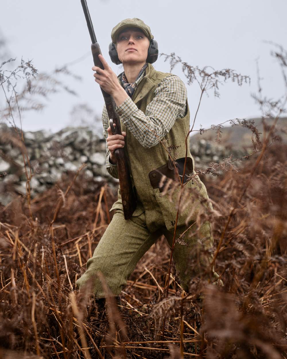 Olive Coloured Harkila Womens Jura Waistcoat on forest background