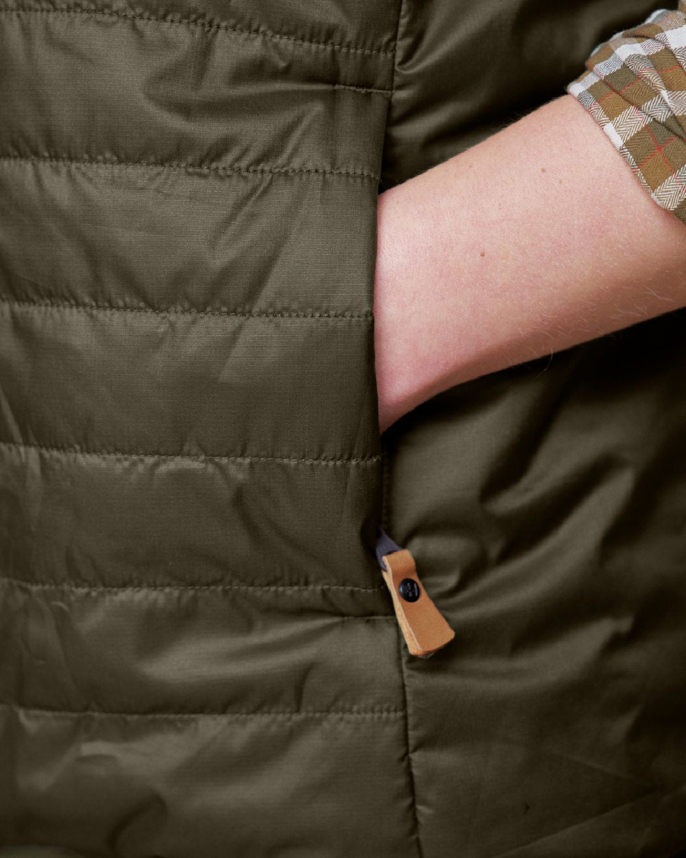 Willow Green Arabian Spice Coloured Harkila Womens Kalix HSP Waistcoat on blurry background