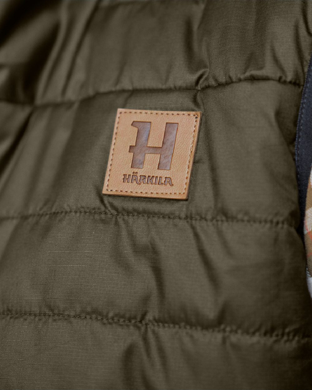 Willow Green Arabian Spice Coloured Harkila Womens Kalix HSP Waistcoat on blurry background