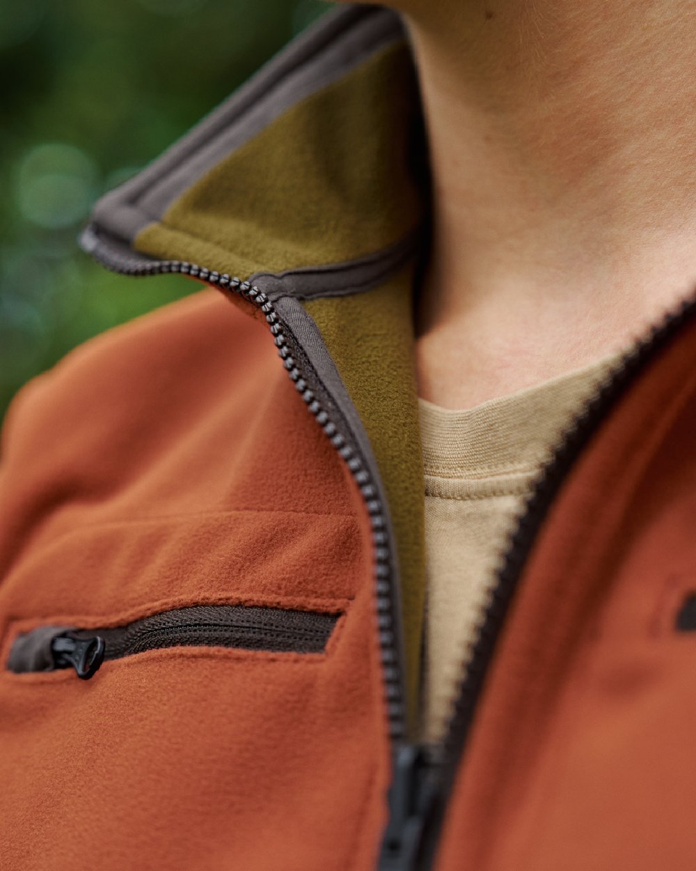 Dark Olive Arabian Spice Coloured Harkila Womens Kamko Reversible Windstopper Fleece Jacket on outdoor background