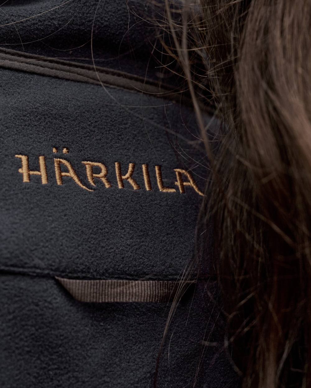 Willow Green Deep Well Purple Coloured Harkila Womens Kamko Reversible Windstopper Fleece Jacket on forest background