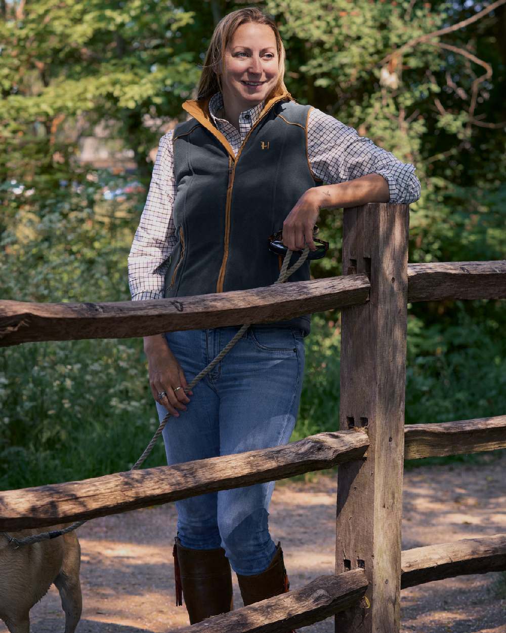 Dark Navy Coloured Harkila Womens Sandhem 200 Fleece Waistcoat on outdoor background