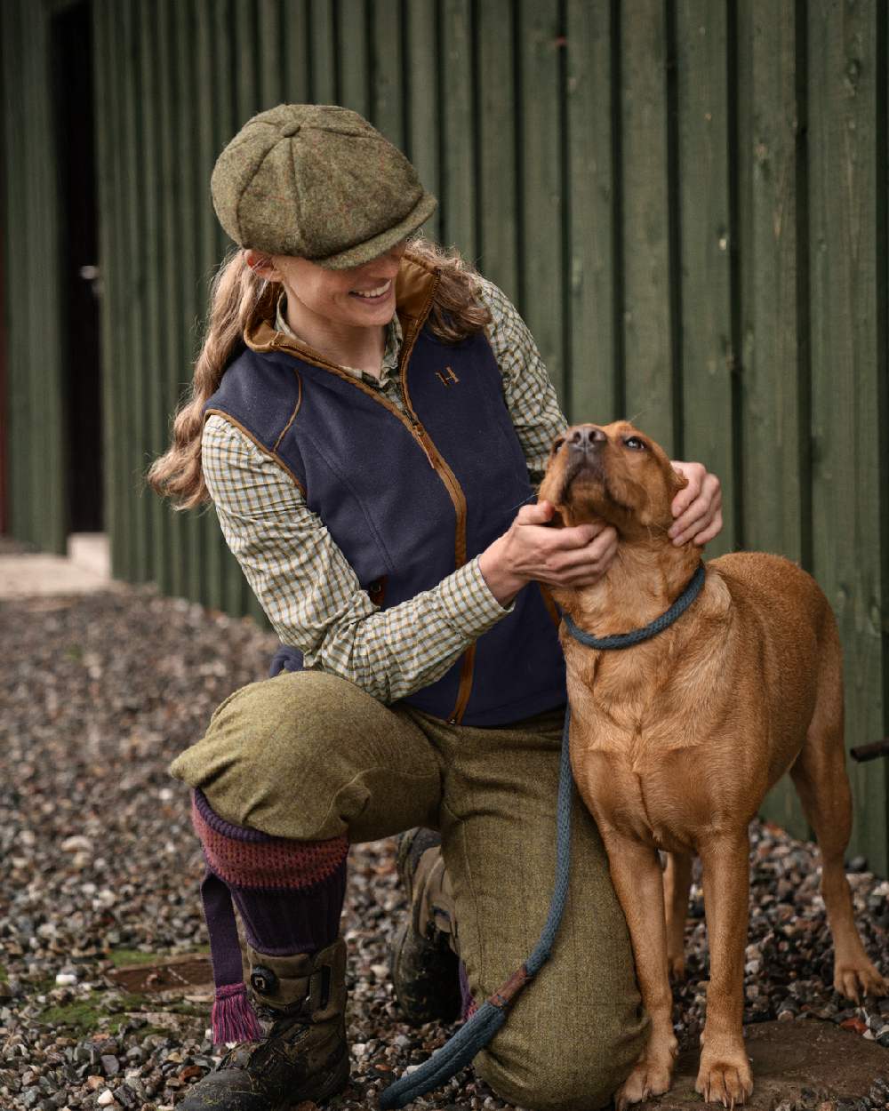 Deep Well Purple Coloured Harkila Womens Sandhem 200 Fleece Waistcoat on outdoor background