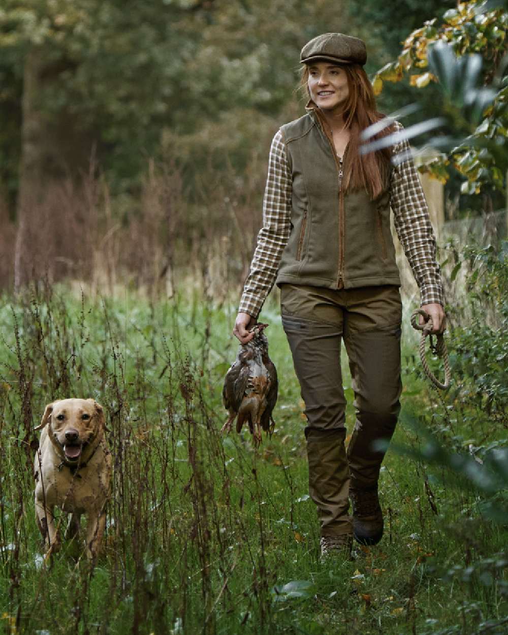 Grape Leaf Coloured Harkila Womens Sandhem 200 Fleece Waistcoat on outdoor background