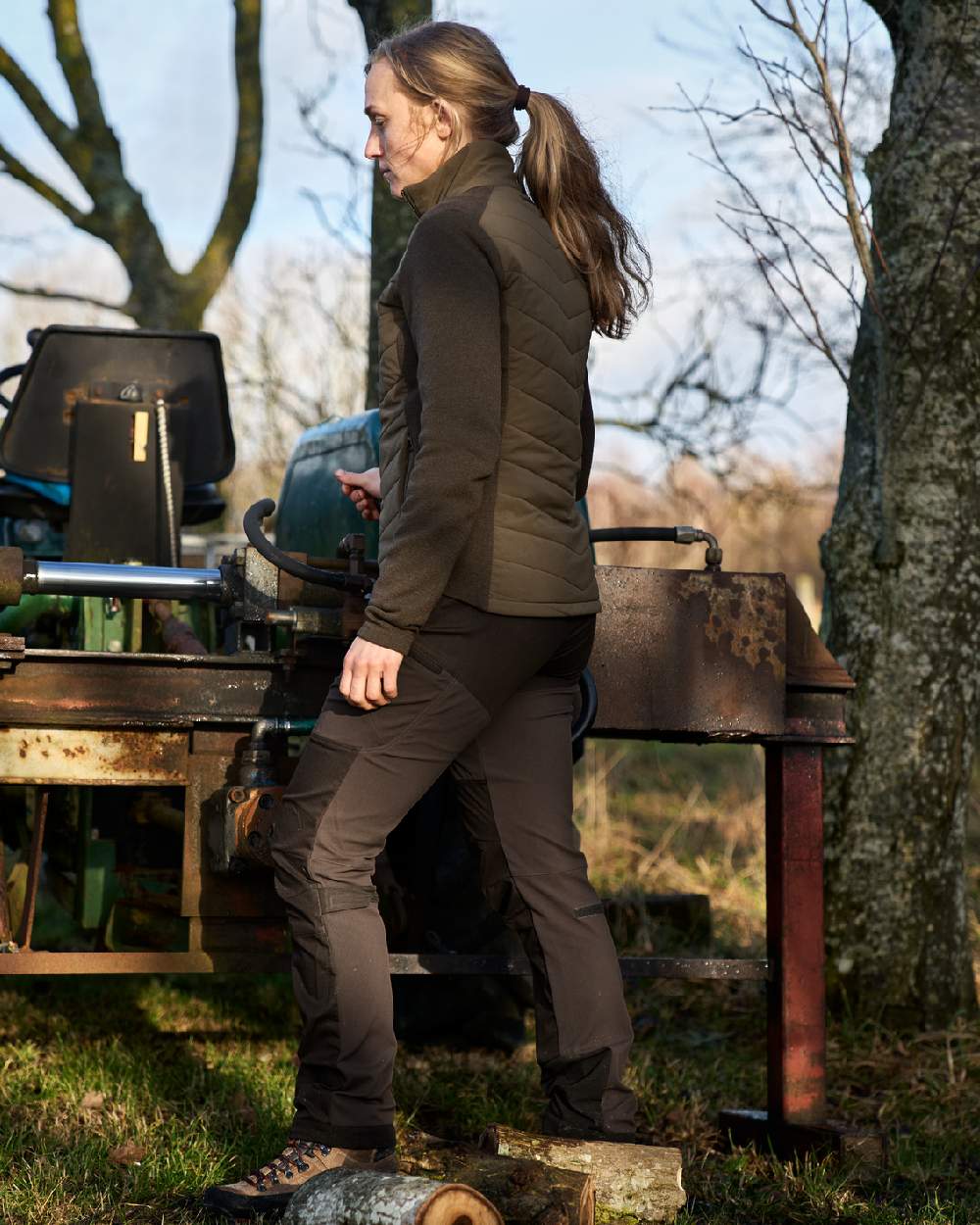 Willow Green Coloured Harkila Womens Sandhem Pro Insulated Cardigan on countryside background