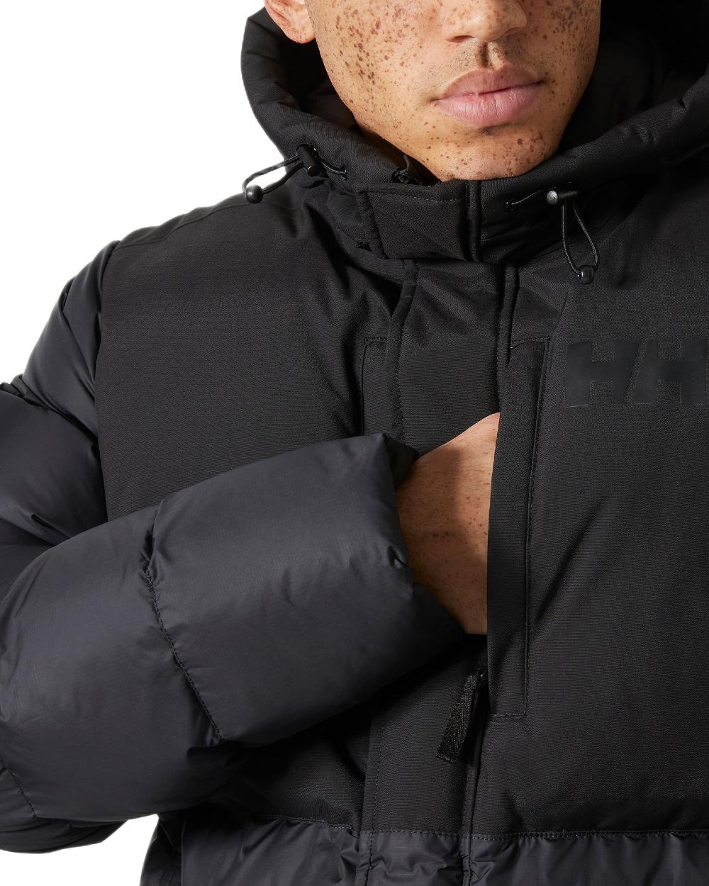 Black Coloured Helly Hansen Active Puffy Long Jacket on white background