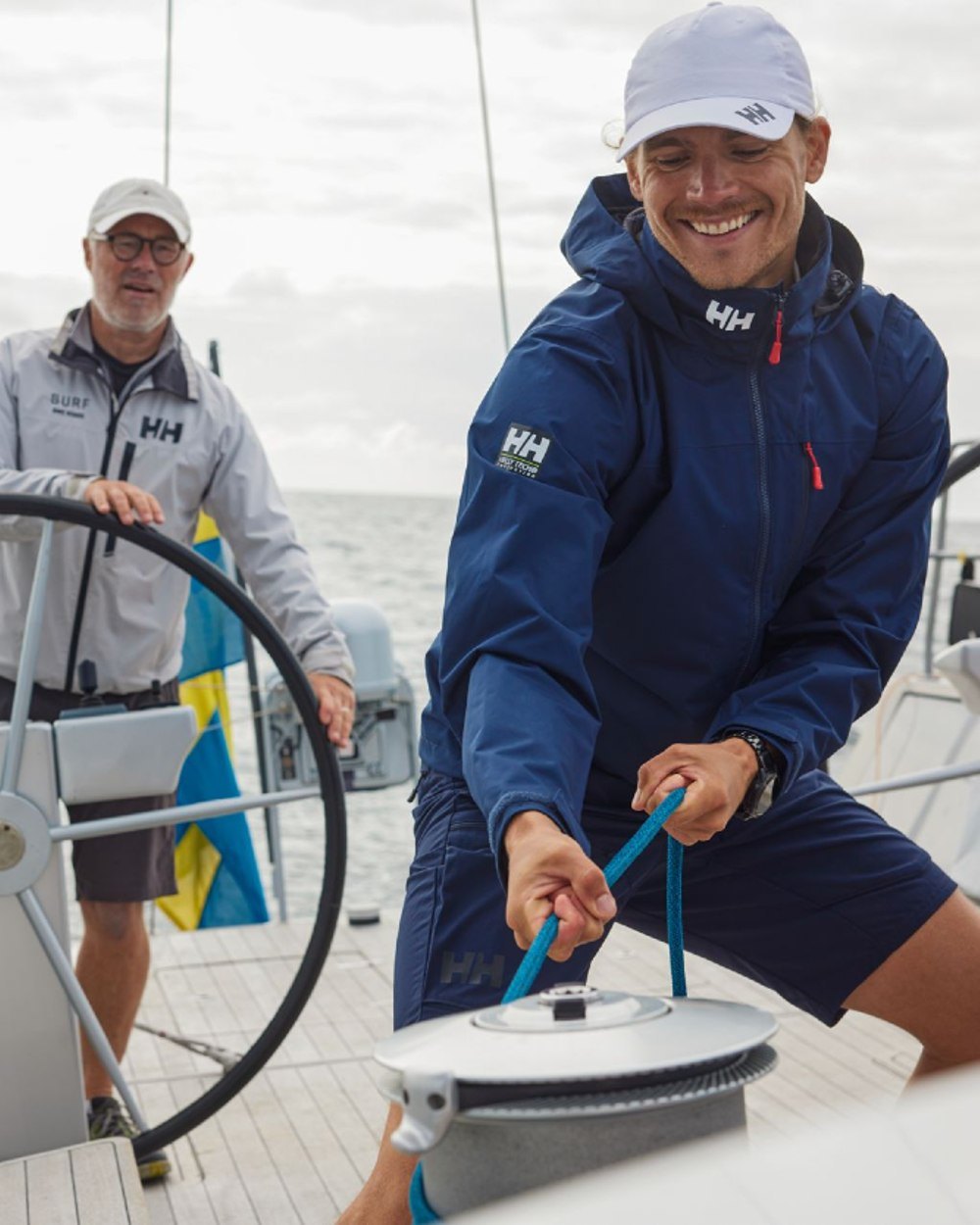White coloured Helly Hansen Crew Cap 2.0 on sea background