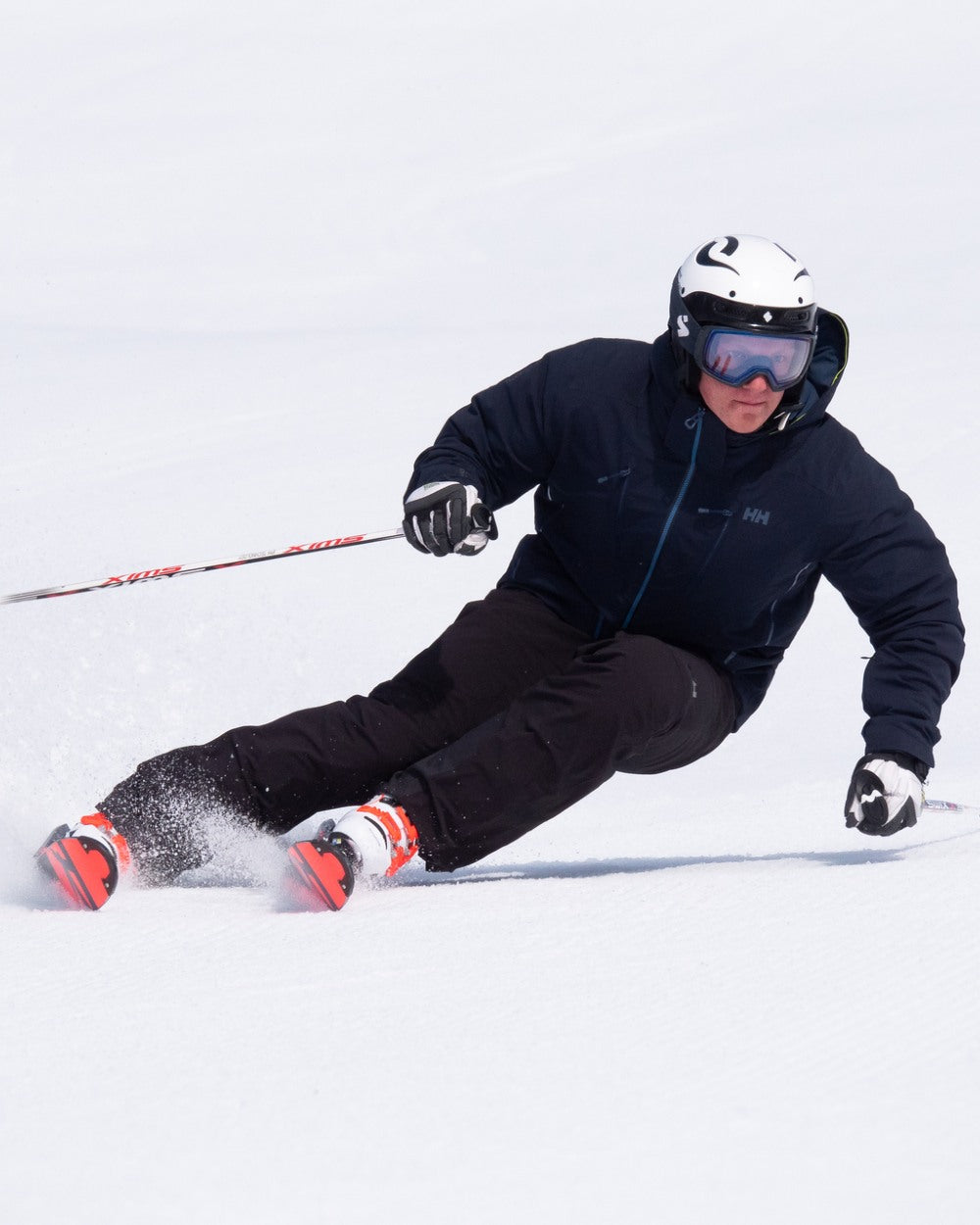 Navy Coloured Helly Hansen Mens Alpha Lifaloft Insulated Ski Pants on snow background