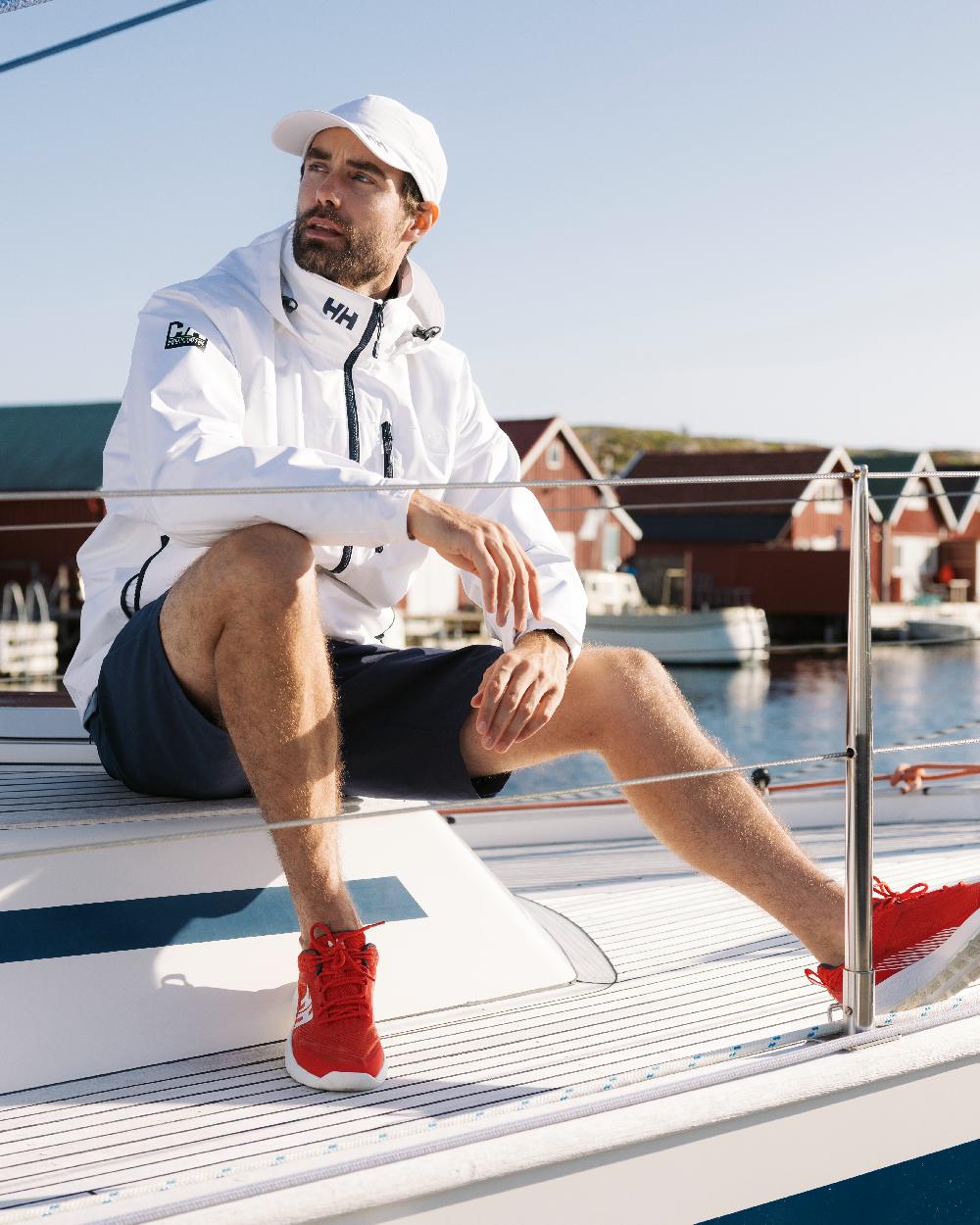 White Coloured Helly Hansen Mens Crew Hooded Jacket 2.0 on outdoor background