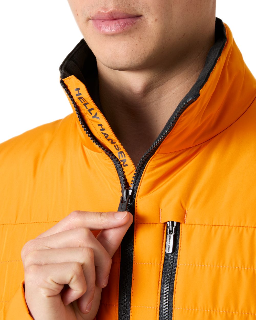 Ignite Orange coloured Helly Hansen Mens Crew Insulated Sailing Jacket 2.0 on white background
