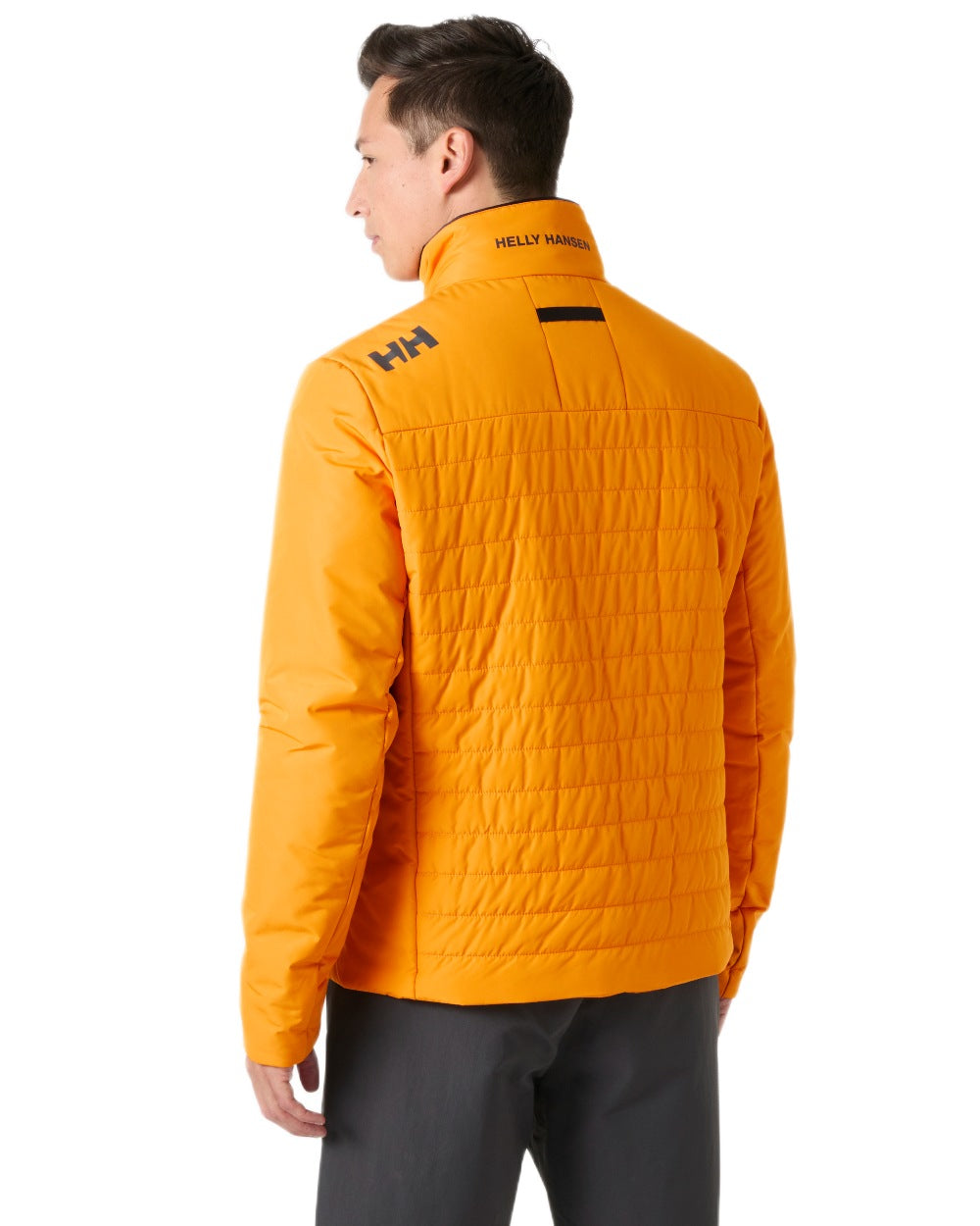 Ignite Orange coloured Helly Hansen Mens Crew Insulated Sailing Jacket 2.0 on white background
