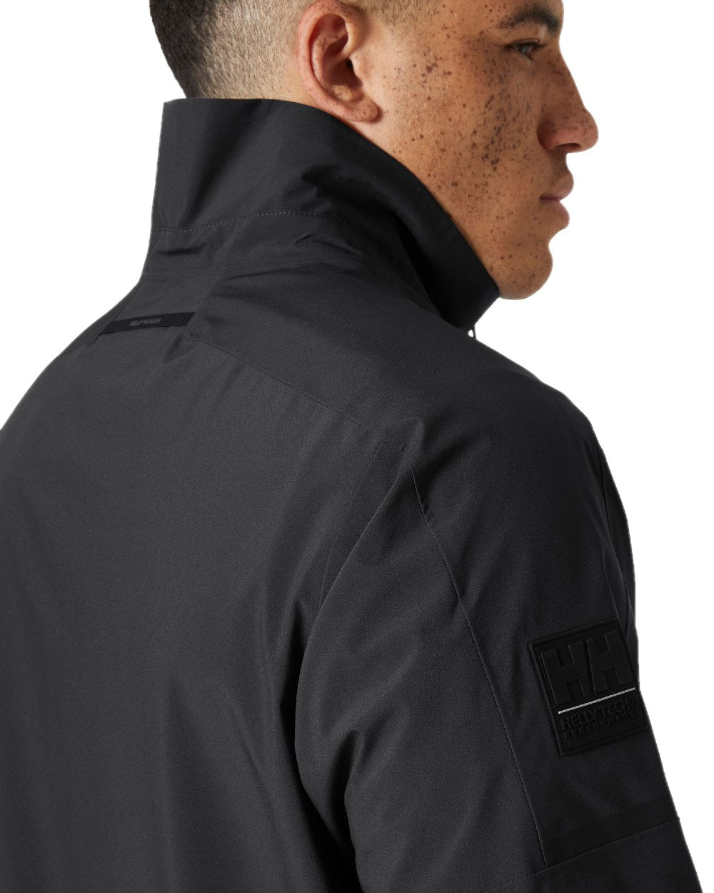 Ebony coloured Helly Hansen Mens HP Racing Bomber Jacket 3.0 on white background