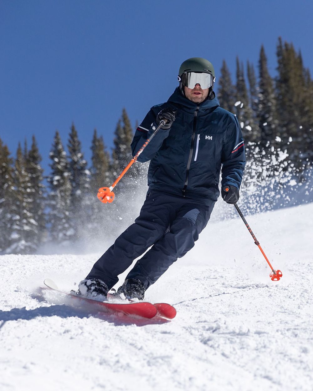 Navy Coloured Helly Hansen Mens Legendary Insulated Ski Pants on snow background