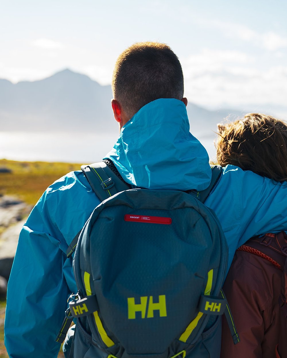 Cyan coloured Helly Hansen Mens Loke Jacket 2.0 on sky background