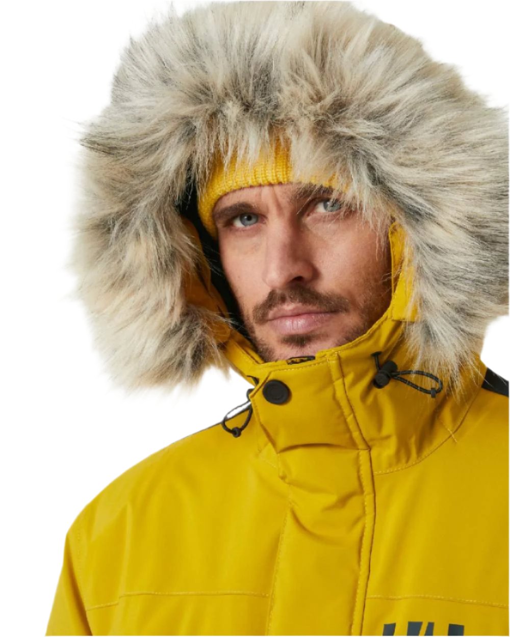 Straw coloured Helly Hansen Mens Reine Winter Parka on white background