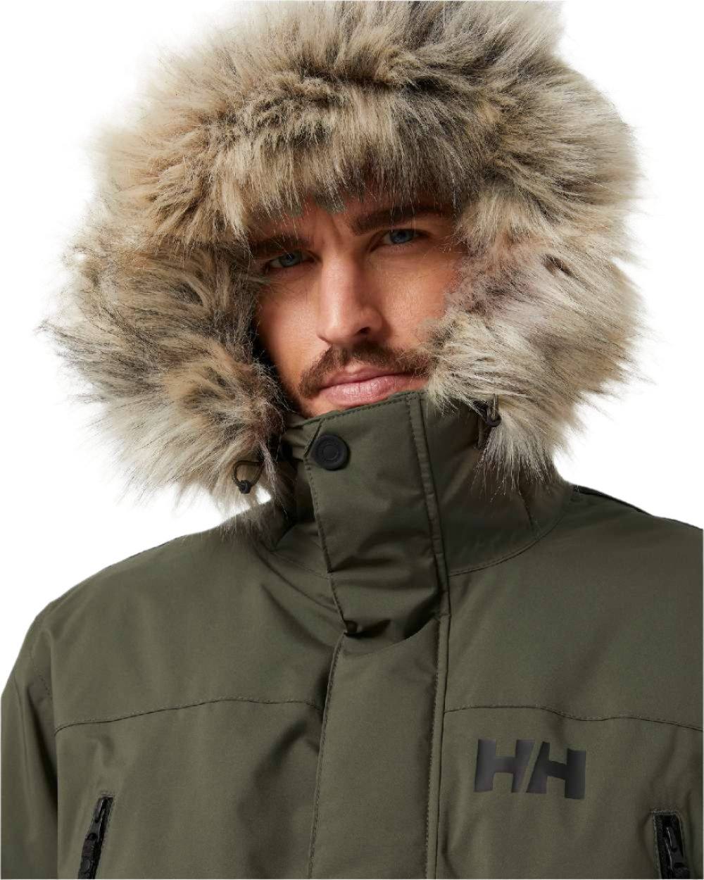 Utility Green coloured Helly Hansen Mens Reine Winter Parka on white background