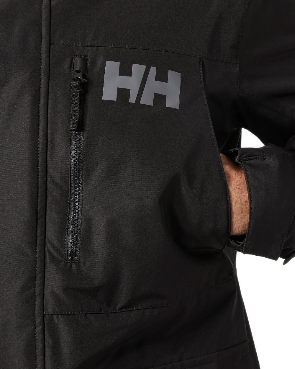 Black Coloured Helly Hansen Mens Rigging Coat on white background