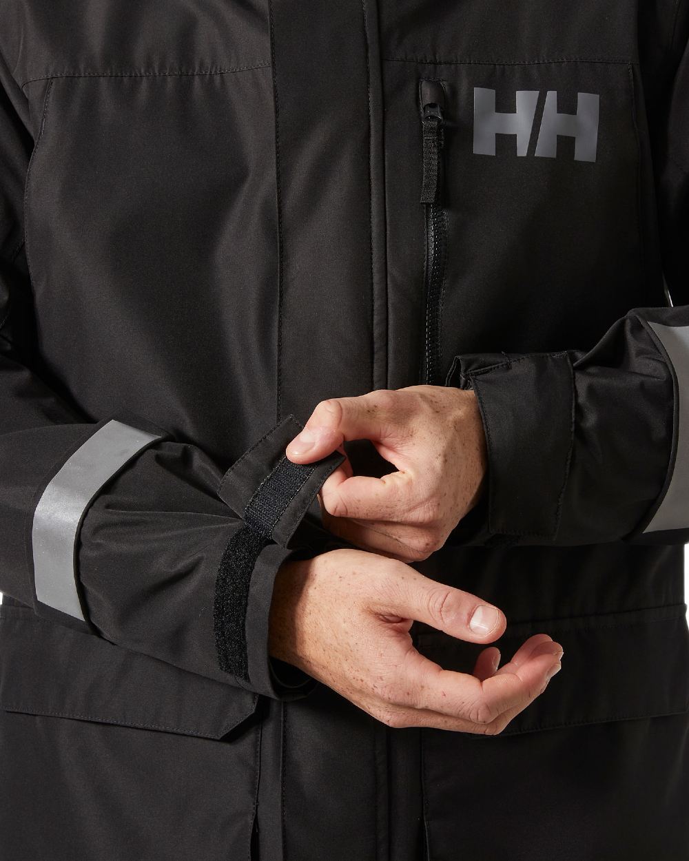Black Coloured Helly Hansen Mens Rigging Coat on white background