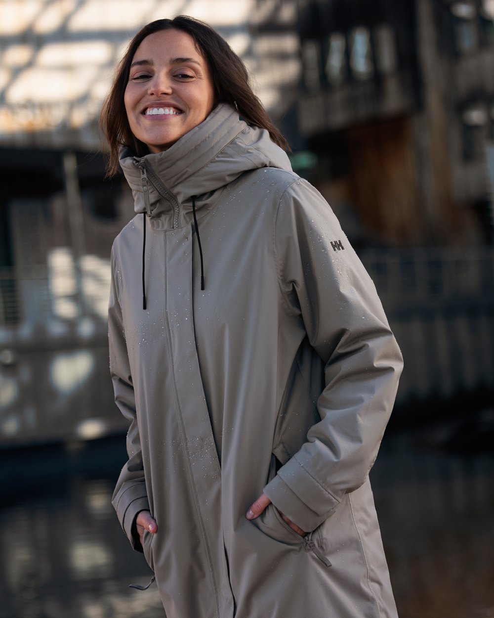 Terrazzo coloured Helly Hansen Victoria Insulated Rain Coat on glass background